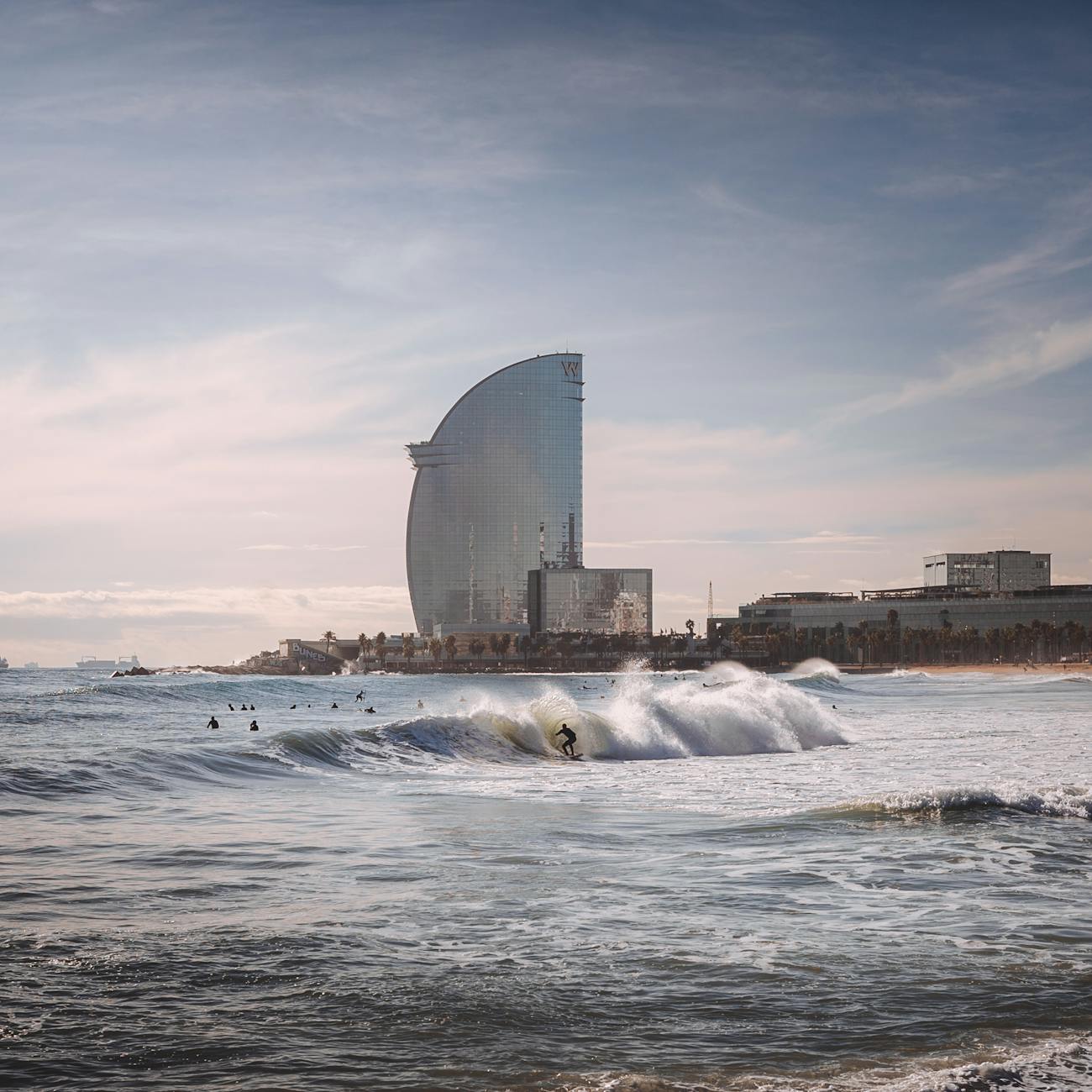 person surfing with high rise building background